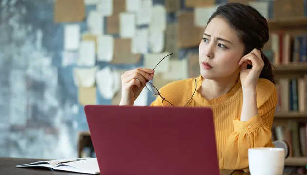 concerned woman on laptop