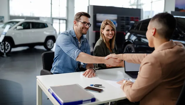 couple buying a car